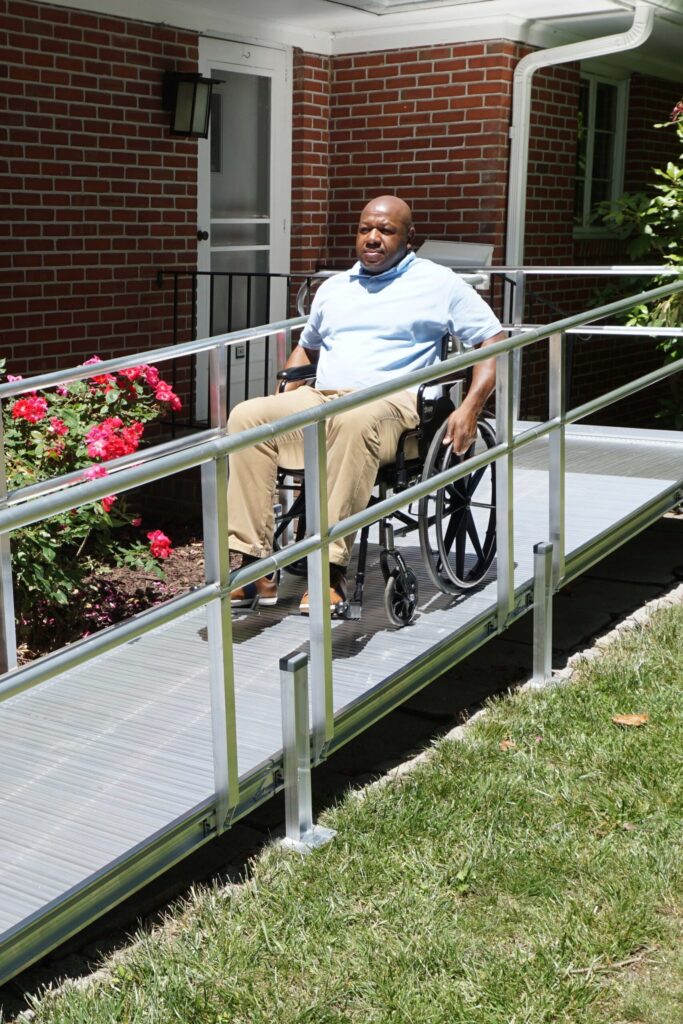 A Man Using A Wheelchair Ramp | Easy Access Ramps